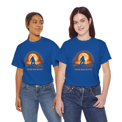 Atmospheric silhouette of a Bigfoot standing majestically in front of a glowing full moon on a hilltop T-Shirt - Atmospheric Gradient Sky Graphic Tee