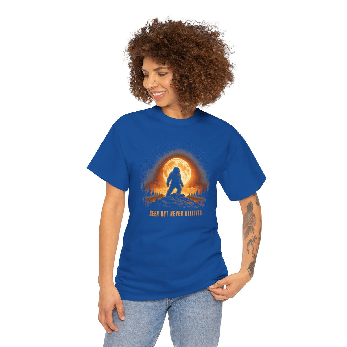 Atmospheric silhouette of a Bigfoot standing majestically in front of a glowing full moon on a hilltop T-Shirt - Atmospheric Gradient Sky Graphic Tee
