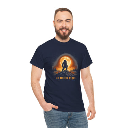 Atmospheric silhouette of a Bigfoot standing majestically in front of a glowing full moon on a hilltop T-Shirt - Atmospheric Gradient Sky Graphic Tee