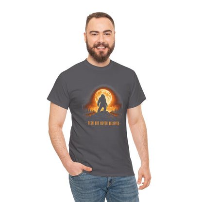 Atmospheric silhouette of a Bigfoot standing majestically in front of a glowing full moon on a hilltop T-Shirt - Atmospheric Gradient Sky Graphic Tee
